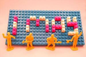 Creative 1 May Illustration with Miniature Workers photo