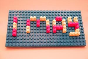 Creative 1 May Concept with Colorful Toy Blocks photo