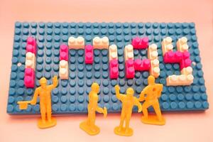 Labor Day Concept Small Workers with 1 May Blocks photo