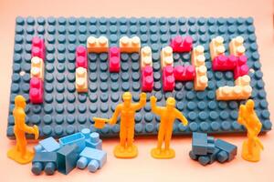 International Workers Day Concept with Toy Figures photo