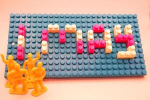 Happy Labor Day 1 May Background with Toy Figures photo