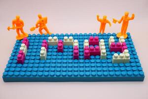 Mini Workers on 1 May Bricks Work and Dedication Theme photo