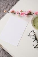 blank A5 paper sheet mockup on coffee table with green matcha tea photo