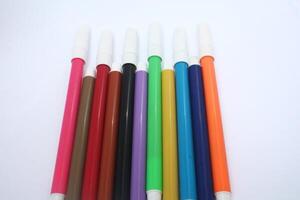 colorful markers isolated on white background, writing equipment, design, concept photo