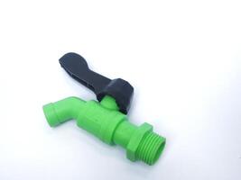 green water tap isolated on white background photo