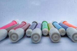 colorful markers isolated on white background photo
