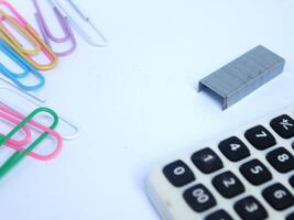 design of work or office equipment tools in the form of paper clips, calculators, and staples photo