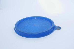 blue colored glass lid isolated on white background photo