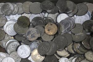 pile of Indonesian metal coins with various types photo
