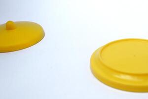 yellow glass lid with negative space on white background photo