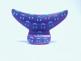 purple hair clip isolated on white background photo