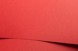 Crimson red paper background with a matte texture and soft tones. Rich ruby and maroon hues create a photo
