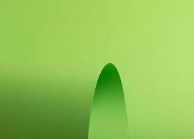 Lime green paper background with a smooth matte surface and a polished gradient. Bright, vibrant photo