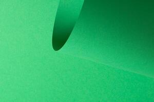 Eden green paper background with a smooth matte finish and softly curved elements. Vibrant, vivid photo