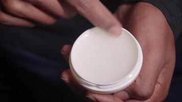 Close up of man hand using petroleum jelly video
