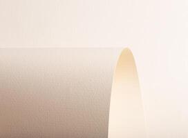 A beige paper background with a textured surface, featuring gentle curves and arching folds. The photo