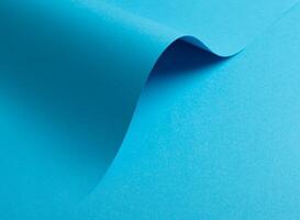 Blue paper background with a smooth matte finish and soft shadows. Vibrant pastel tones and a subtle photo