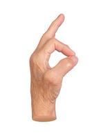 Elderly female hand making an OK gesture, symbolizing approval, positivity, and agreement. Wrinkled photo