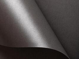 Dark graphite paper texture with a smooth, monochrome gradient and elegant finish. Blank artistic photo