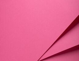 Pink paper texture with a soft matte finish. Elegant and minimalistic background with a rich, photo
