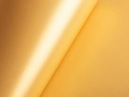 Gold paper texture with a shiny, glossy surface. Elegant and luxurious background with a smooth, photo
