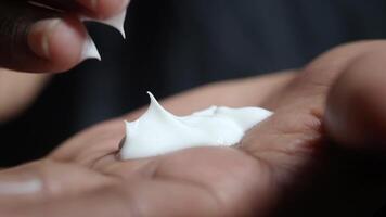 Applying cream on hands for better skin care routine video