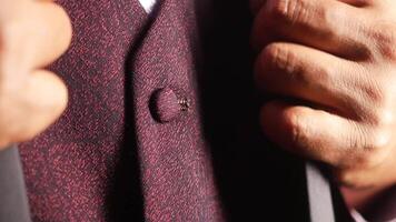 Elegant suit details captured in close-up during formal event video