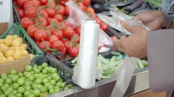 Selecting fresh produce at a bustling local market in autumn video