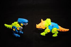 Modular Dinosaur Toy - Colorful Building Blocks T-Rex on black background photo