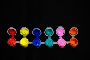 Rainbow Paint Palette on Black - Vibrant Art Colors photo