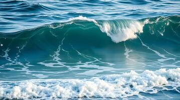 A wave breaking on the ocean surface photo