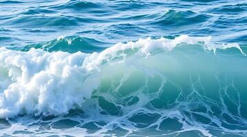 A wave breaking on the ocean surface photo