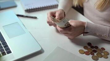 close-up of a woman's hands counting her savings. A woman is making a budget. Lack of funds and inflation do not allow saving for the future. A new approach to investments, saving. video