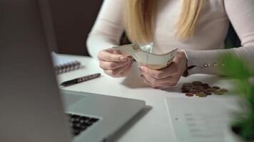 Close-up of a woman counting money. Paying for education, a foundation for the future. Budgeting is an important part of modern life. Loans and collateral do not give a sense of freedom video