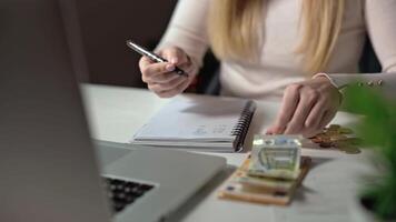 close-up of a woman's hands counting her savings. A woman is making a budget. Lack of funds and inflation do not allow saving for the future. A new approach to investments, saving. video