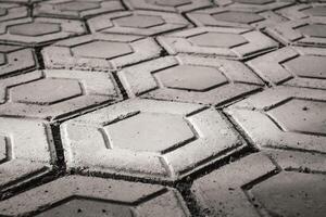 Black and white hexagonal brick for flooring. Paving block backgrounds in monochrome color. Texture and Details. Bricks and blocks are made from cement. Negative Space photo