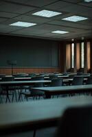 Empty classroom with blackboard and chairs photo
