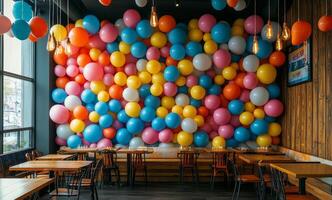A restaurant with colorful balloons hanging from the ceiling photo