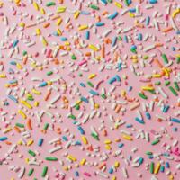 Sprinkles on a pink background photo