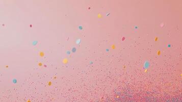 A pink background with confetti falling from the sky photo