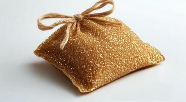 A small bag of honey with a bow tied to it photo
