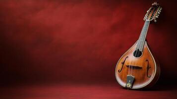 An old mandolin on a red background photo
