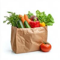 A brown paper bag filled with vegetables and fruits photo