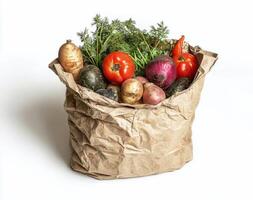 A brown paper bag filled with vegetables and other produce photo
