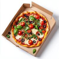 A pizza in a cardboard box with tomatoes, basil and cheese photo