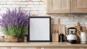A blank frame with a vase of lavender flowers on a kitchen counter photo