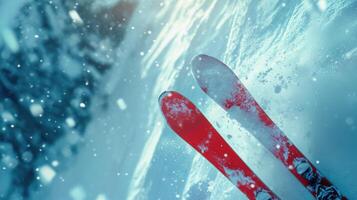 Two skis are on the ground in the snow photo