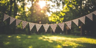 A bunting with a chevron pattern hanging from a tree photo