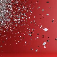 A red background with silver cubes falling photo