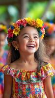 A little girl in a colorful dress smiling photo